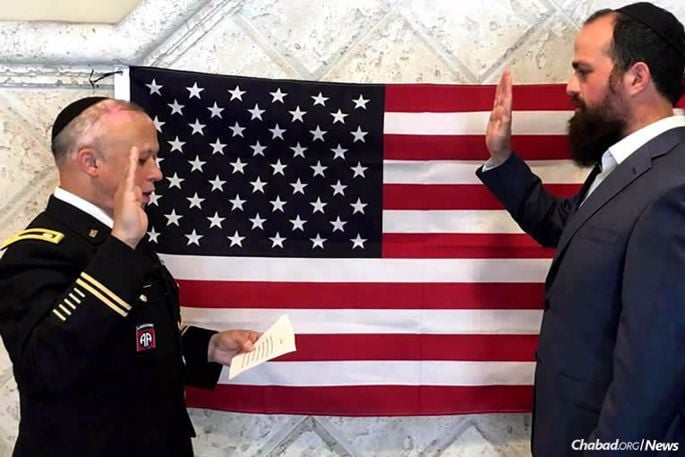 Rabbi Levy Pekar gets sworn in to the U.S. Air Force by U.S. Army Chaplain (Lt. Col.) Rabbi Shmuel Felzenberg, left, of the Office of the Chief of Chaplains, on July 12, 2016. Currently, Pekar, 29, is in basic training at Maxwell Air Force Base in Montgomery, Ala.
