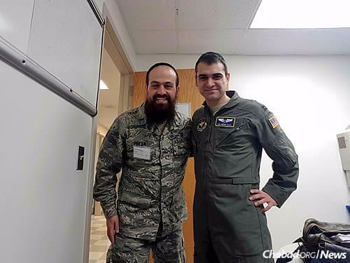With Dr. Solomon Saul, a Chabad-Lubavitch flight surgeon whose family has helped provide Pekar with food on the training base
